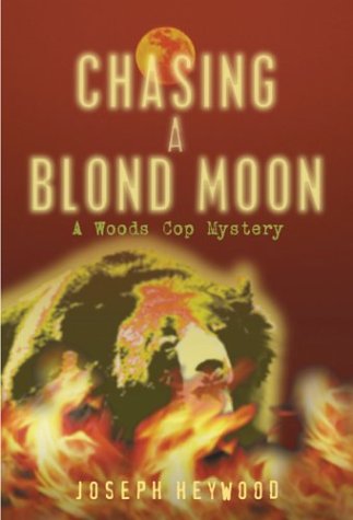 cover image CHASING A BLOND MOON: A Woods Cop Mystery