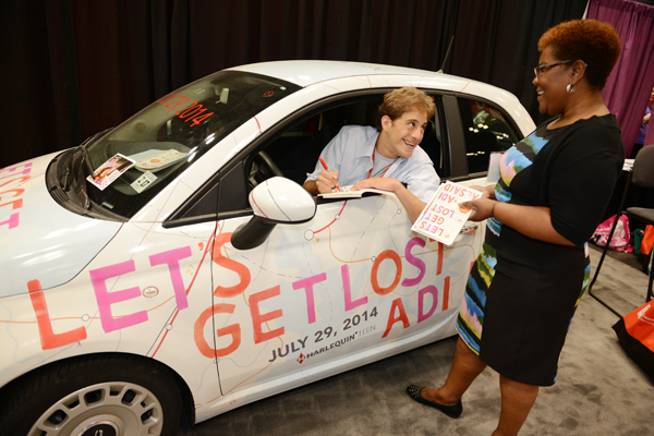 Alsaid in the 'Let's Get Lost' Fiat 500, on the floor at BEA. SteveKagan.com